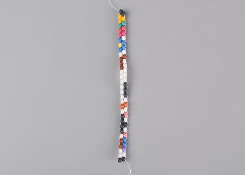 Two columns of multicolored seed beads sewn together